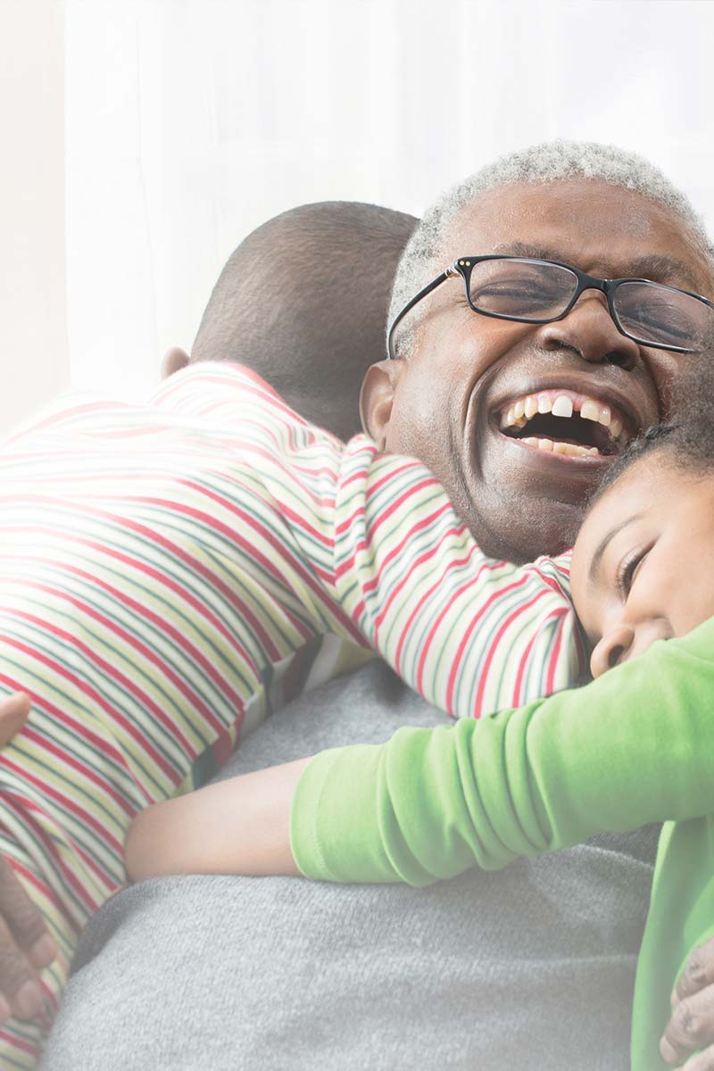 Man laughing with children