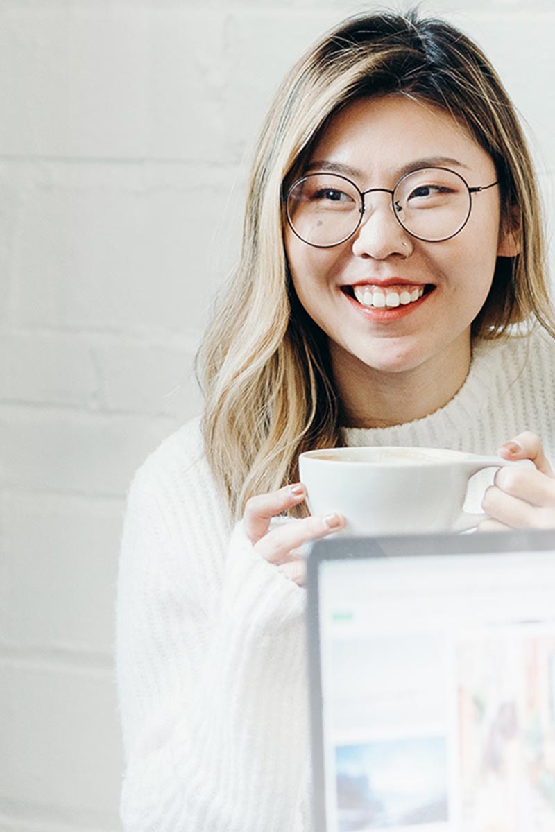 woman in glasses drinking coffee